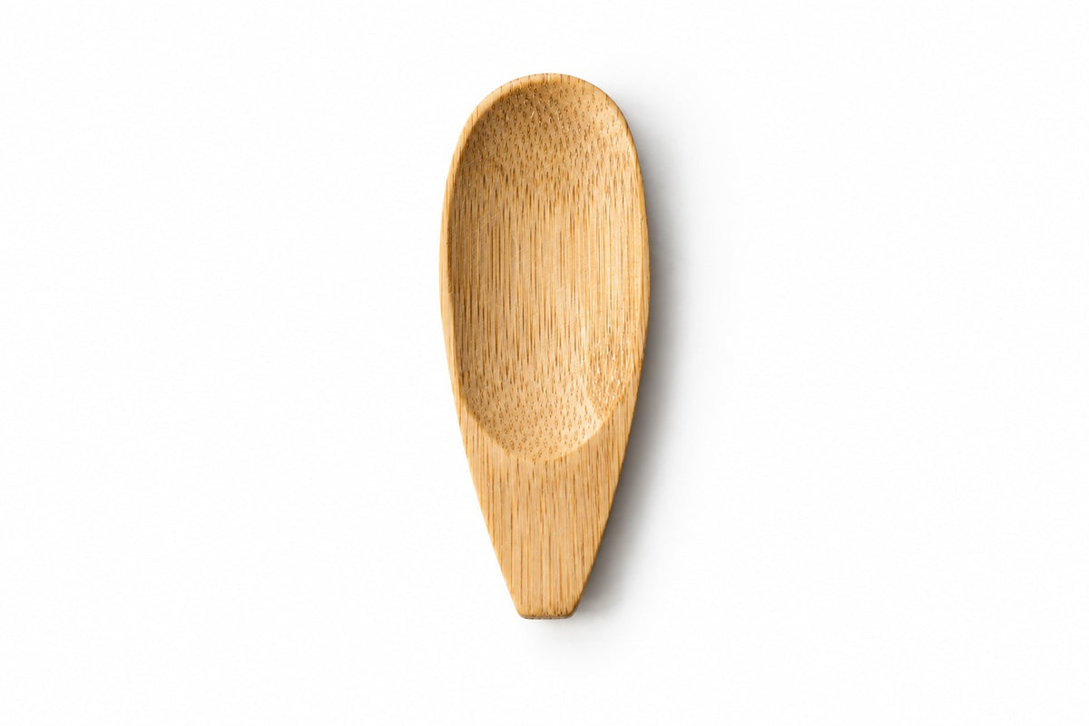 A wooden applicator made of light natural bamboo, shown against a plain white background.