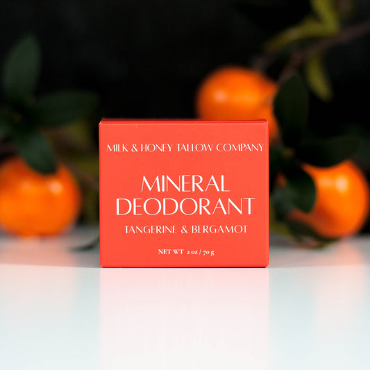 Tangerine and Bergamot Mineral Deodorant in Orange box with tangerines in the background