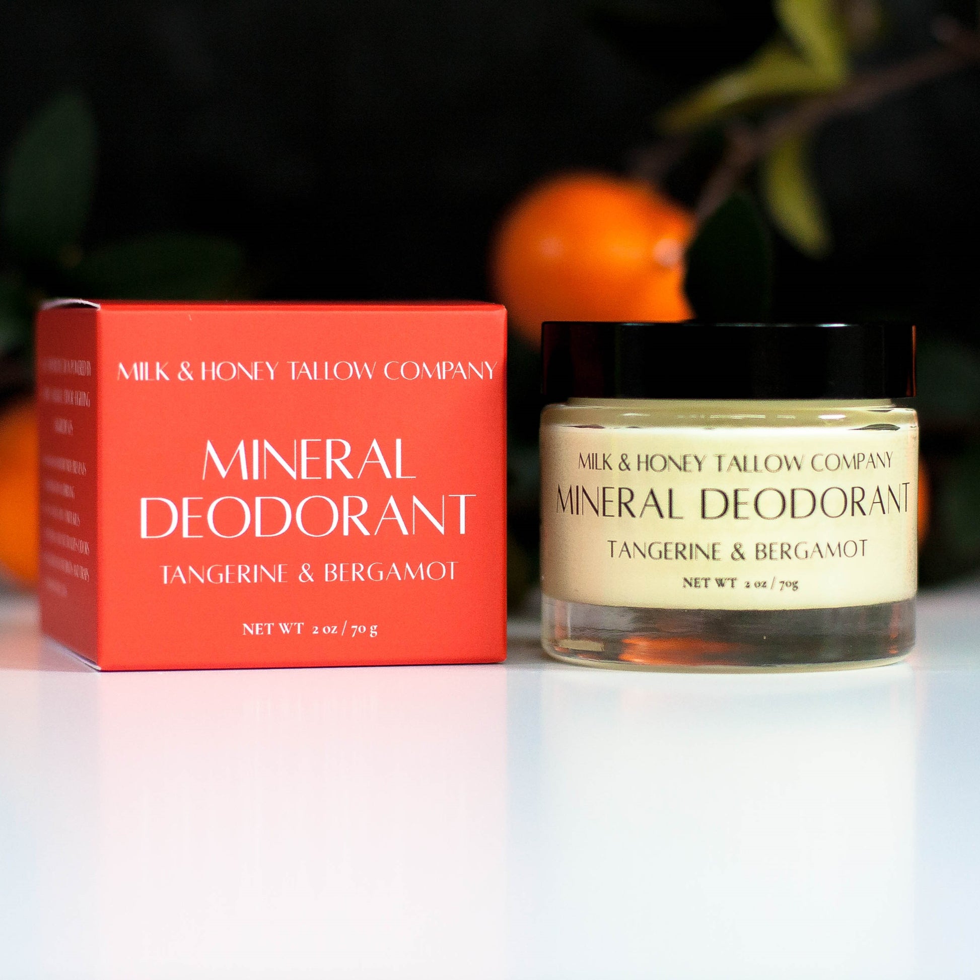 Box and Jar of Tangerine and Bergamot Mineral Deodorant with tangerines in the background