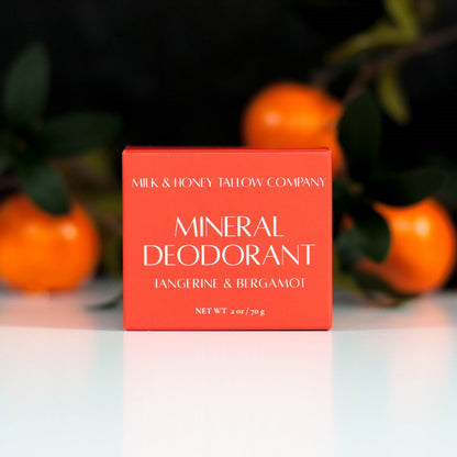 Tangerine and Bergamot Mineral Deodorant in Orange box with tangerines in the background