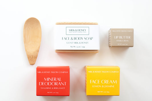 Collection of Milk & Honey skincare products including soap, deodorant, cream, and lip butter on a white background.