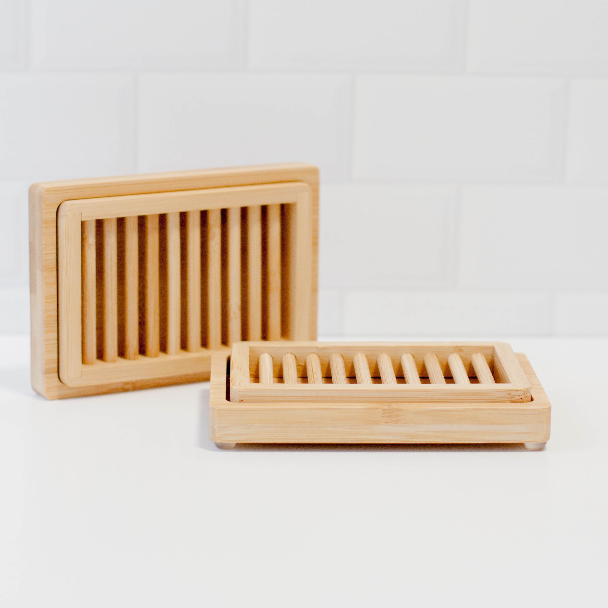 Dual-Layer bamboo soap dishes on counter with tile backsplash