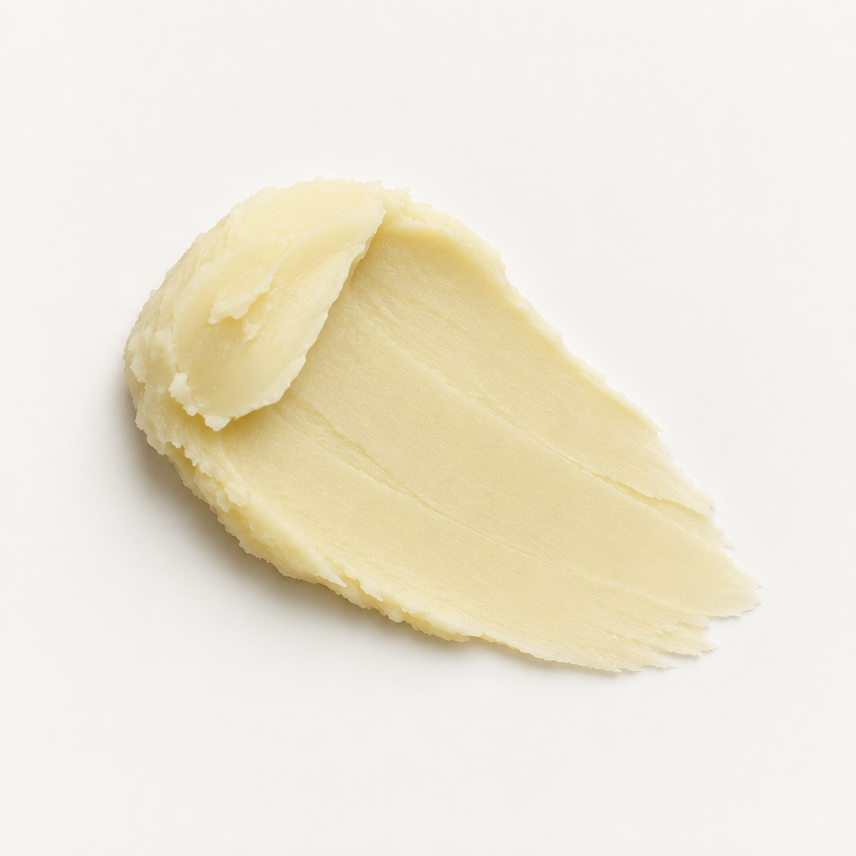 A thick, creamy, cosmetic smear of Tangerine & Bergamot Mineral Deodorant shown on a clean white background.