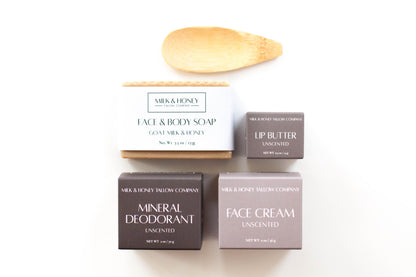 Collection of Milk & Honey Tallow Skincare products including tallow face cream, mineral deodorant, tallow lip butter, and goat milk & honey face and body soap on a white background.